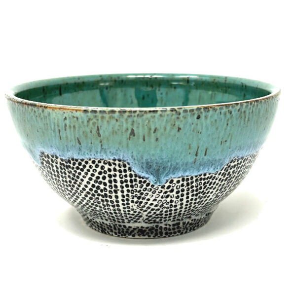 The Zumba Ramen Bowl is crowned with a tranquil blue glaze that washes over a rhythmic textured pattern like waves, marrying motion and calm in one piece.