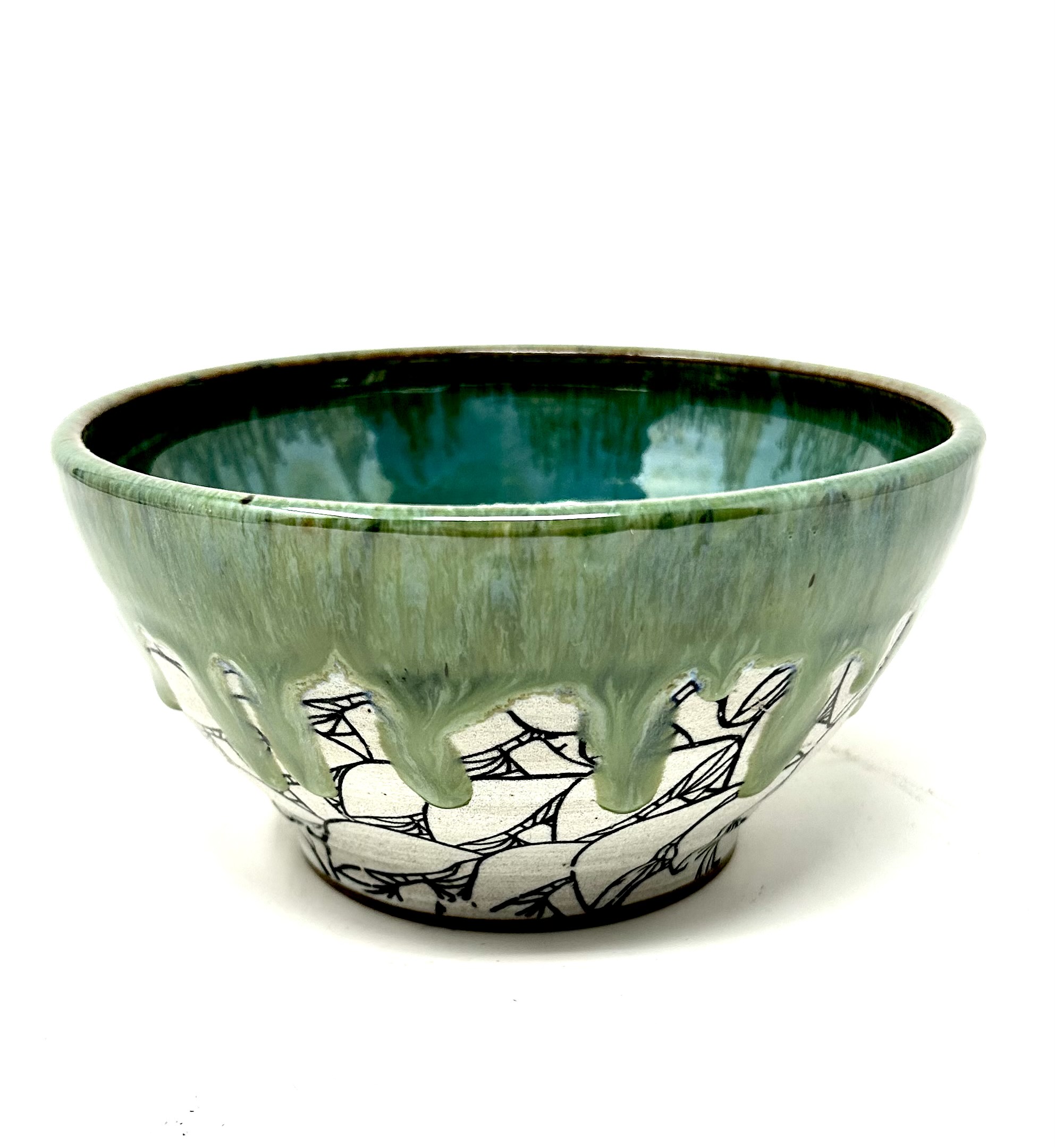This Mossy Mushroom Bowl is a crafted stoneware piece that marries the earthiness of the forest floor with the ethereal quality of morning mist. The hand-etched mushrooms around the base are set against the natural backdrop of speckled clay, giving way to a verdant glaze that seems to drip over the edges like dew on lush foliage.